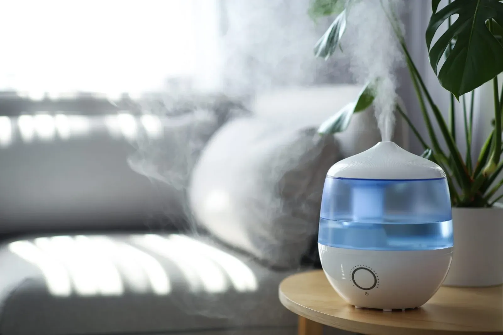 A blue humidifier placed in the living room.