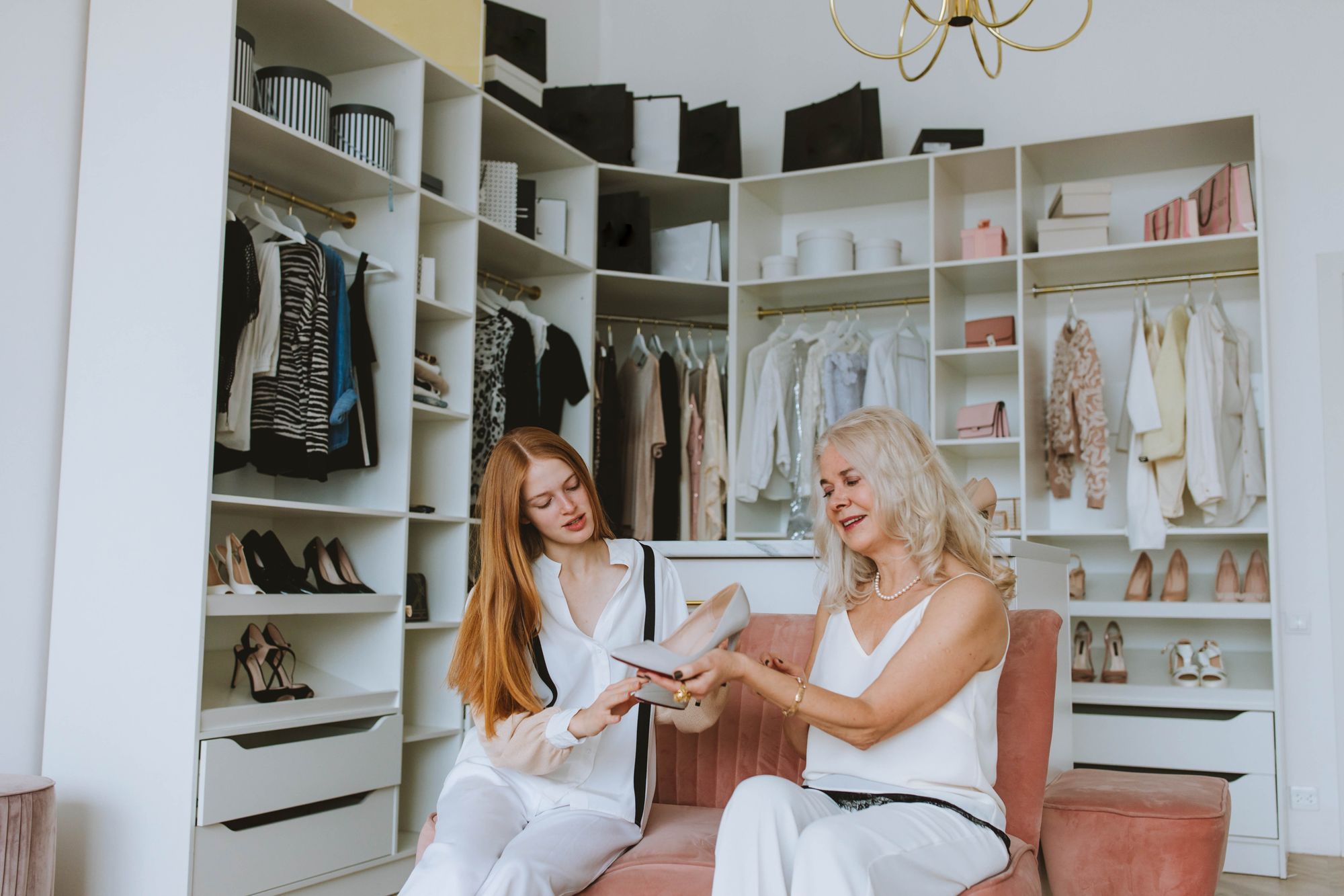 Two women with a walk-in closet.