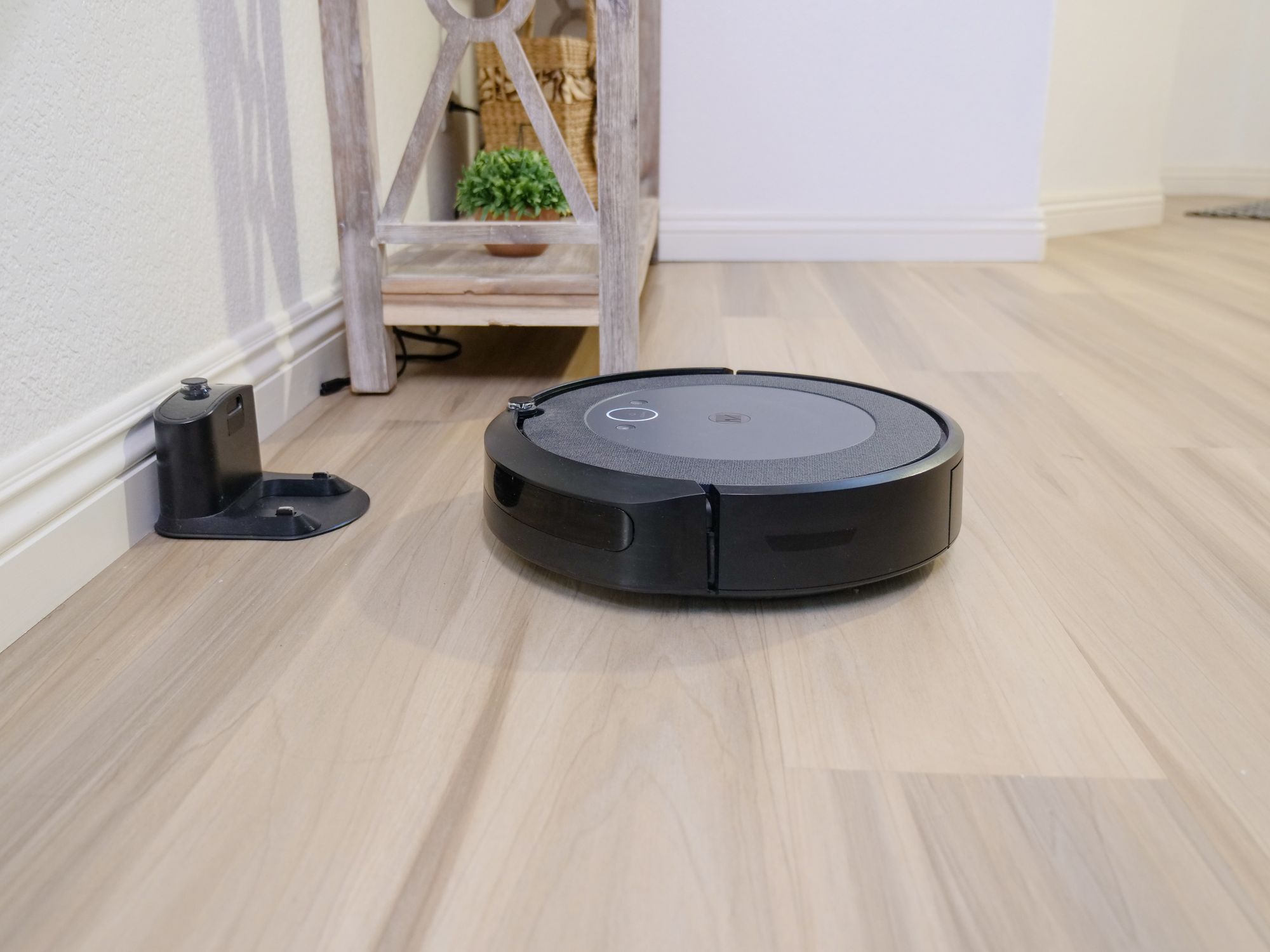 A robotic vacuum cleaner on the floor.