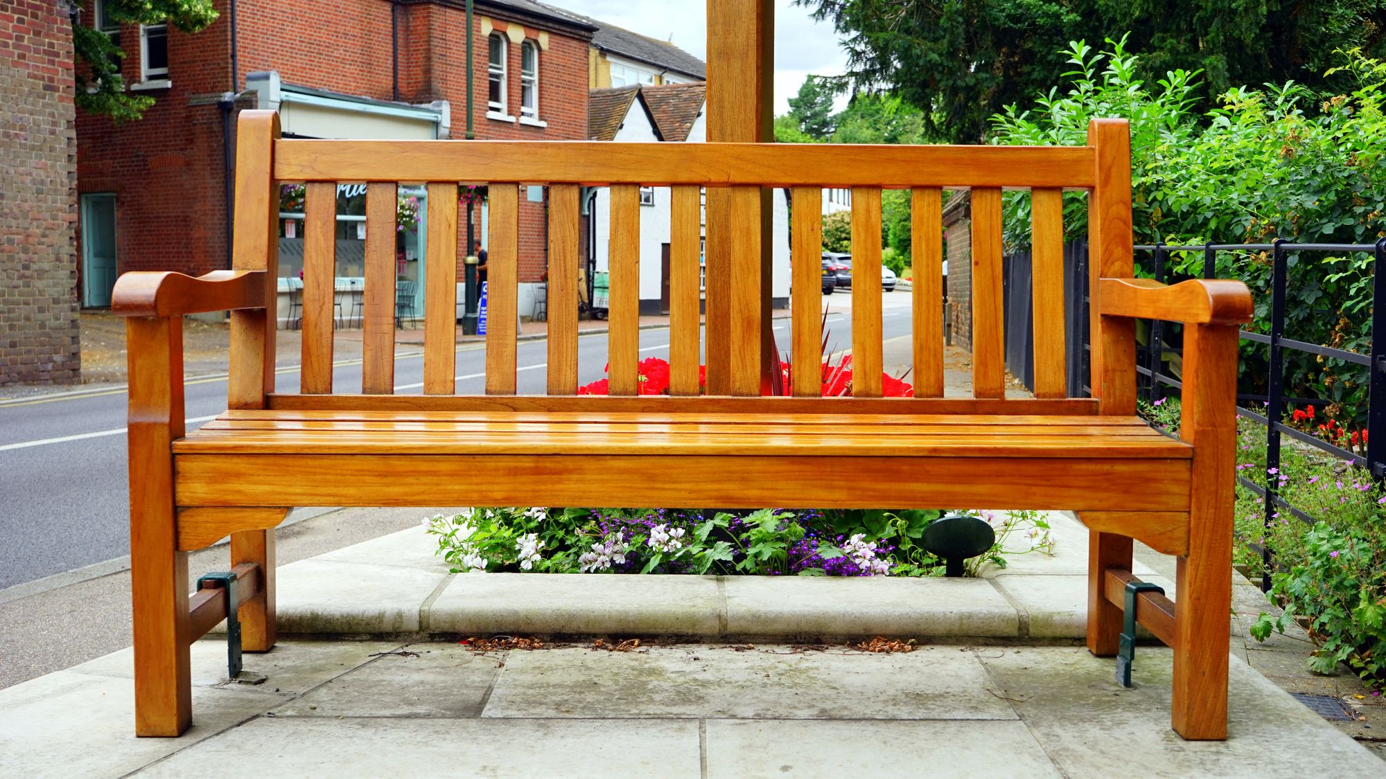 A wooden bench outside.