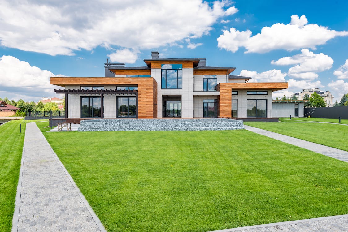 A two-story house with 2-panel sliding glass doors.