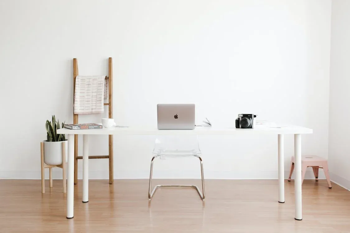 A home office with a white desk.