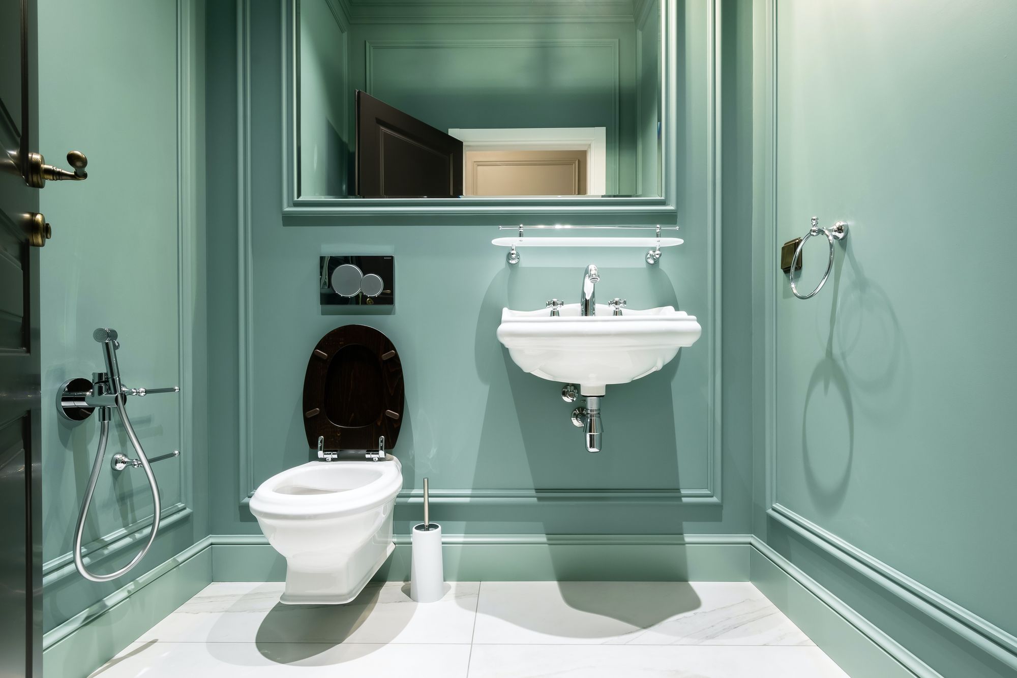 A powder room with a white water closet.