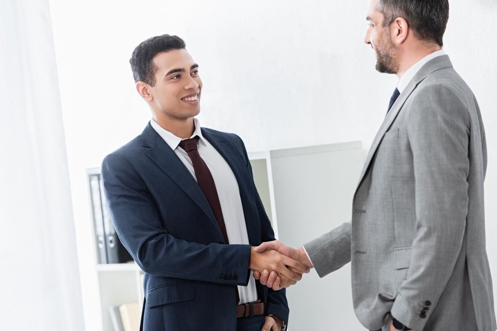 Two men shaking hands.