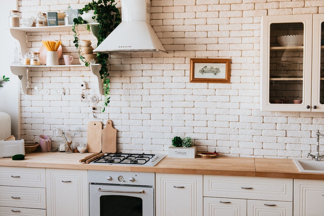 A white kitchen with wooden elements.